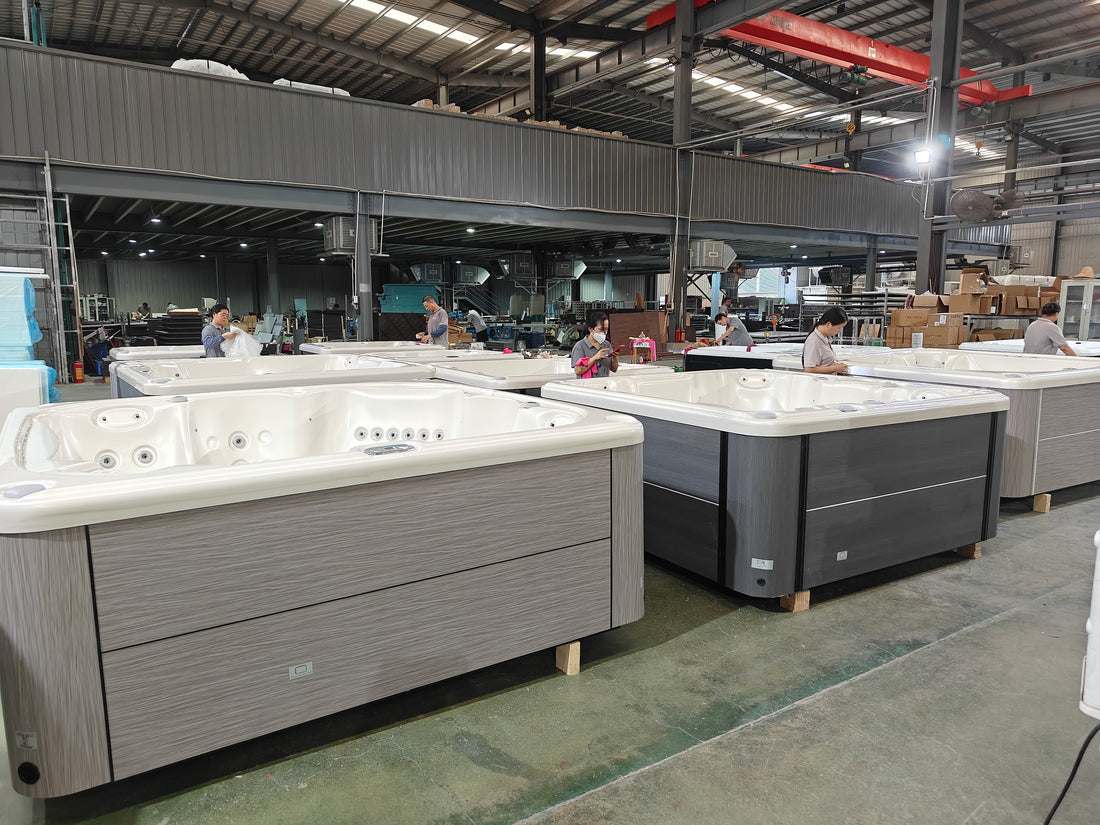 Valora factory team inspecting completed hot tubs before water testing and packing