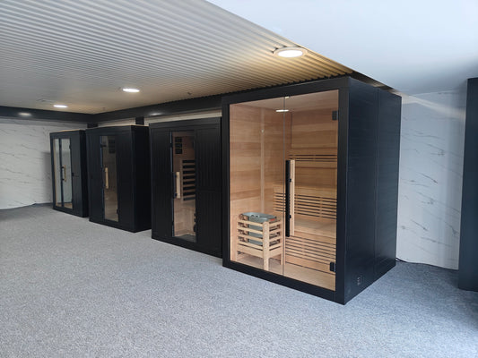 Traditional and infrared sauna cabins in the Valora Spas showroom for sauna cleaning and maintenance guidance