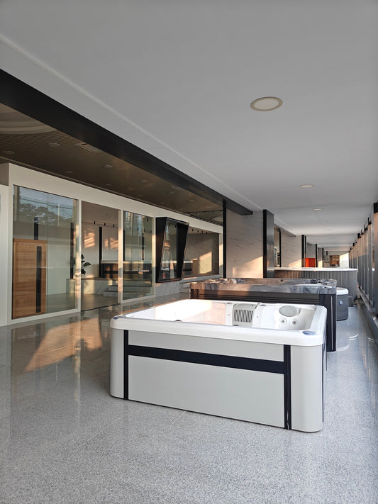 Rows of hot tubs displayed inside the Valora Spas showroom for dealer product comparison