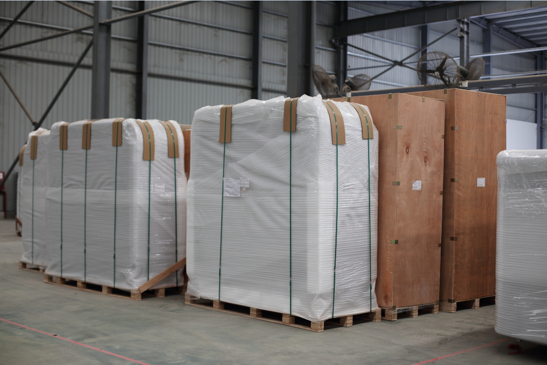 Packaged Valora hot tubs protected on pallets before shipment from the factory