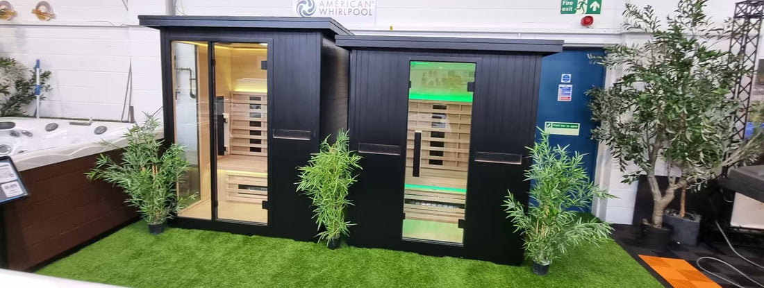 Two dark exterior sauna cabins displayed at East Yorkshire Showground in 2025