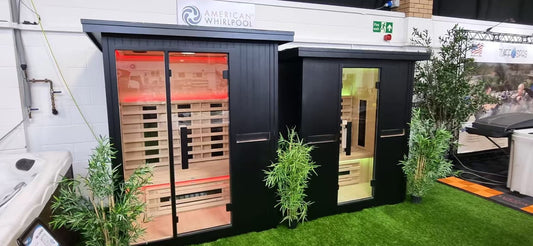 Two outdoor-style sauna displays with different roof overhangs and glazed door layouts