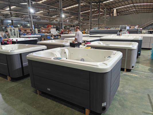 Wide factory view of finished hot tubs during inspection at Valora Spas